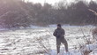 Man fishing trout in forest river