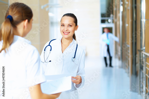 Photo: Portrait of two friendly female doctors Portrait of two friendly female doctors
