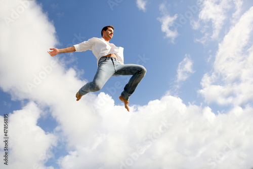 Photo: Man jumping in the air with joy Man jumping in the air with joy