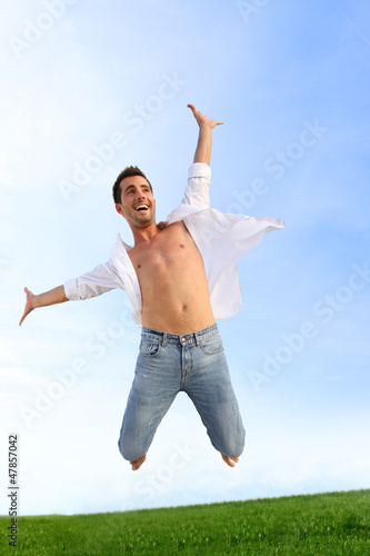 Photo: Man jumping in the air with joy Man jumping in the air with joy