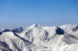 Snowy mountains and blue clear sky