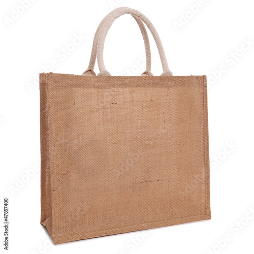 Photo: Recycled hessian sack shopping bag isolated on white Recycled hessian sack shopping bag isolated on white