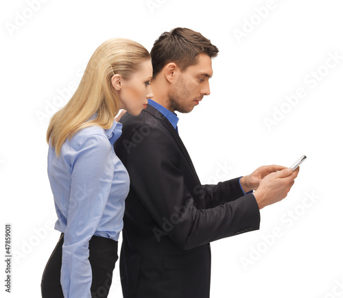 Photo: man and woman reading sms man and woman reading sms
