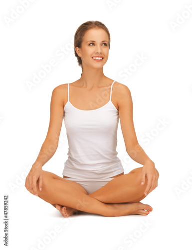Photo: woman in undrewear practicing yoga lotus pose woman in undrewear practicing yoga lotus pose