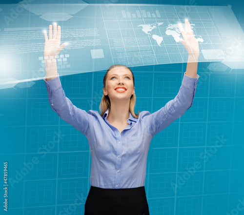 Photo: woman working with virtual screens woman working with virtual screens
