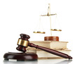 Golden scales of justice, gavel and books isolated on white