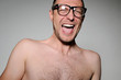 Young man in glasses laughing happily