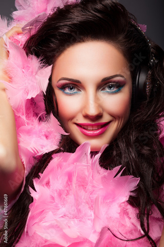 Photo: Happy Fashion Woman Face with Feathers Closeup Portrait Happy Fashion Woman Face with Feathers Closeup Portrait