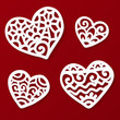 Vector cut out paper white lacy hearts on dark red background