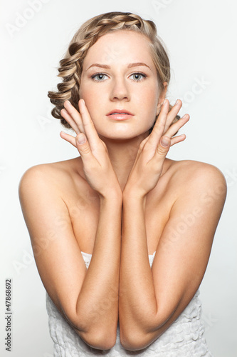 Photo: Portrait of young woman with braid hairdo Portrait of young woman with braid hairdo
