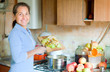 Woman cooks apple jam