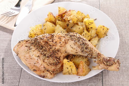 Photo: grilled chicken leg and potatoes grilled chicken leg and potatoes