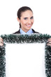 smiling businesswoman holding christmas billboard