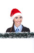 businesswoman with santa hat holding banner