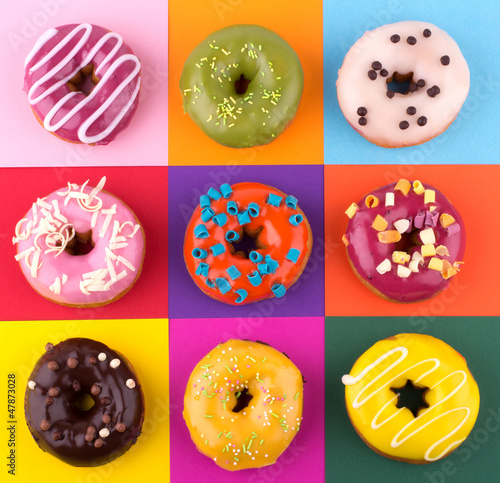 Photo: Donuts isolated on colorful background Donuts isolated on colorful background