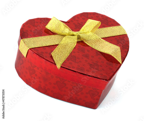 Photo: Heart red present box with golden ribbon isolated on white Heart red present box with golden ribbon isolated on white