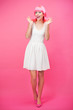 Beautiful young woman over pink background