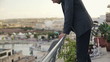 Young tired, frustrated businessman resting on terrace