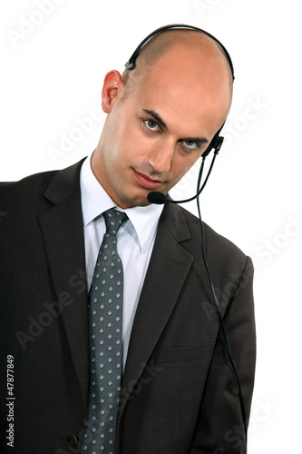 Photo: businessman with headset on his head businessman with headset on his head