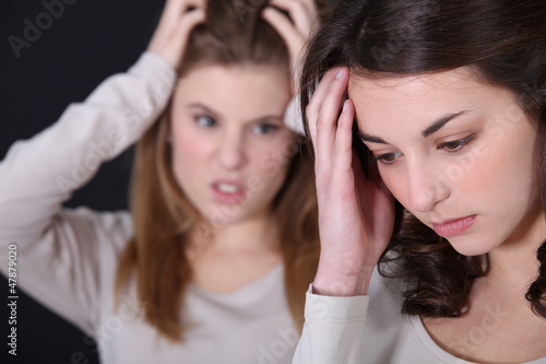 Photo: Two young women arguing Two young women arguing