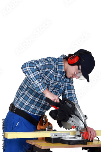 Photo: joiner at work with workbench and machine joiner at work with workbench and machine