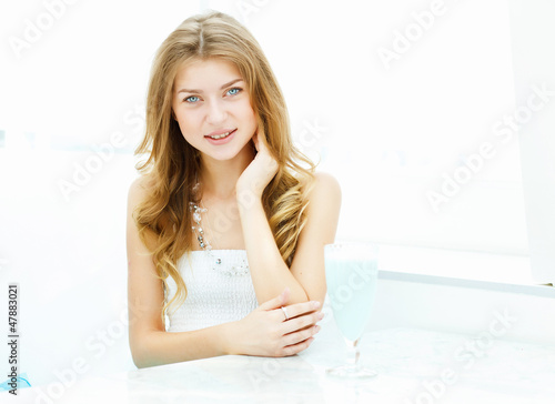 Photo: Young woman in cafe Young woman in cafe
