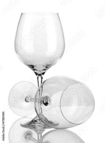 Photo: Two empty wine glasses isolated on white Two empty wine glasses isolated on white