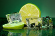 Ice cubes with lime on darck green background
