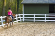Young girl riding a running horse