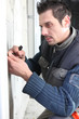 Man scraping a wall