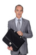 Elegant senior man on white background