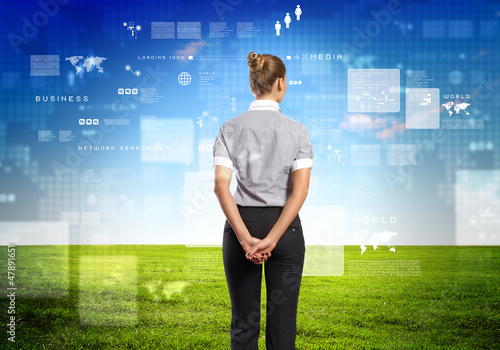Photo: Business person with digital symbols Business person with digital symbols
