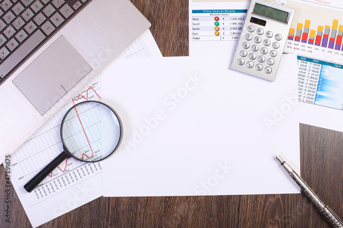 Photo: Businessman workplace with papers Businessman workplace with papers