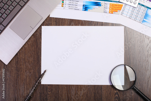 Photo: Businessman workplace with papers Businessman workplace with papers