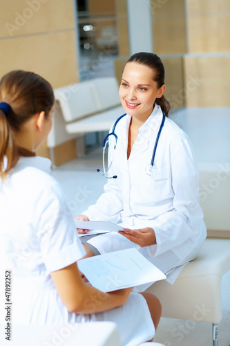 Photo: Portrait of two friendly female doctors Portrait of two friendly female doctors