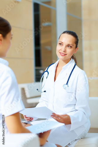 Photo: Portrait of two friendly female doctors Portrait of two friendly female doctors