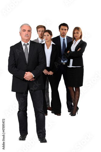 Photo: Studio shot of businessman and his team Studio shot of businessman and his team