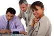 Three people in business meeting
