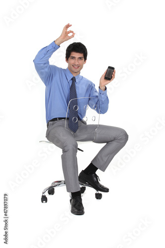 Photo: Executive receiving good news. Executive receiving good news.