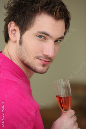 Photo: Young man drinking wine Young man drinking wine