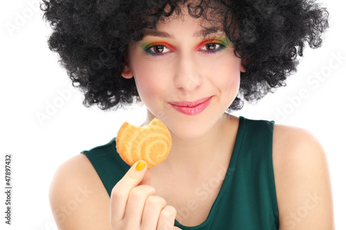 Photo: Funky woman eating cookie Funky woman eating cookie