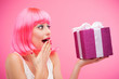 Surprised woman receiving gift