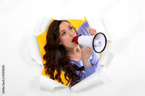 Photo: Brunette speaking into megaphone Brunette speaking into megaphone
