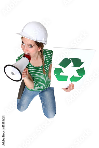 Photo: Construction worker promoting recycling Construction worker promoting recycling