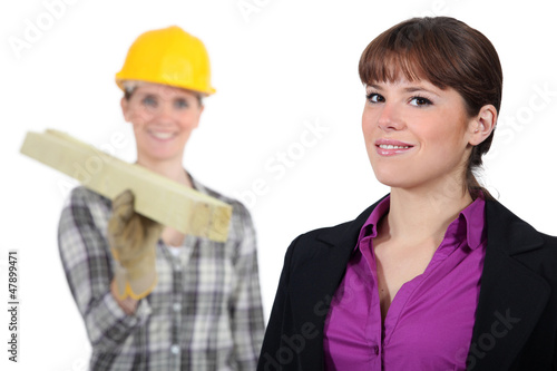 Photo: craftswoman and young businessman posing together craftswoman and young businessman posing together