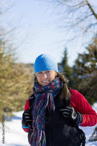 Photo: Woman hiker walking in winter mountains Woman hiker walking in winter mountains