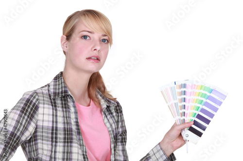 Photo: A woman holding a color model. A woman holding a color model.
