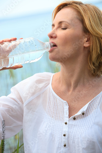 Photo: Woman drinking water Woman drinking water