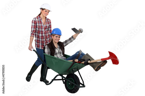 Photo: duo of female bricklayers duo of female bricklayers