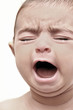 Baby crying, baby with eyes closed, screaming.